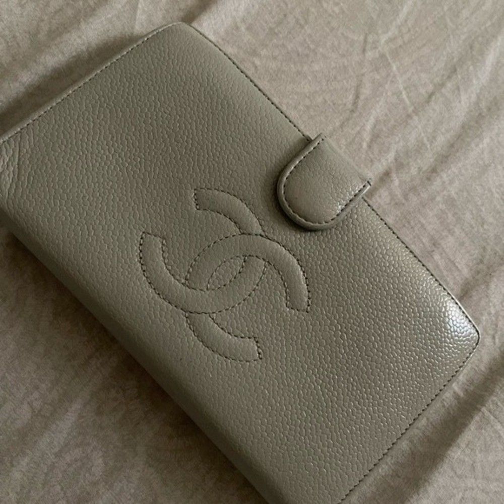 Green pre loved Chanel long wallet a lot of signs of use and wear